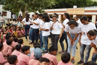 Volunteers interact with the excited children