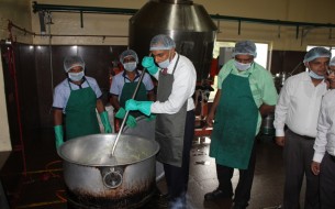 His Excellency enthusiastically takes part in the cooking process