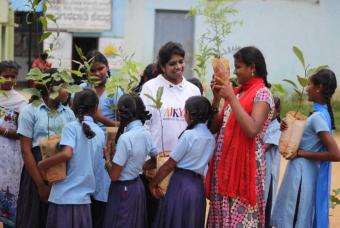 Saplings being handed out to the children