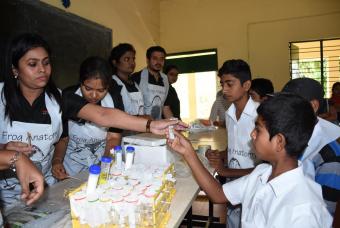 DNA sampling kits being handed out the children