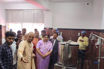 The esteemed guests take a kitchen tour to see how it operates. 