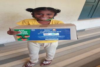 A child is overjoyed at receiving a Happiness Kit