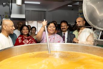 Smt Manjula Aravind Limbavali takes part in the cooking process.