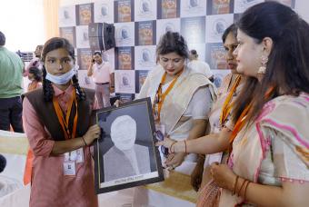 A beneficiary receives a gift at the event