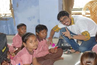 Curious children meet the volunteers