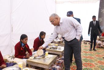 Children being served cooked meals