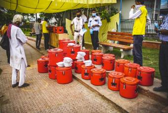 Akshaya Patra prepares to serve freshly cooked meals.