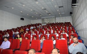 The audience watches the shoe distribution event with rapt attention at R.A. Bazar Primary School, Lucknow