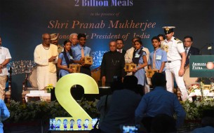 Shri Pranab Mukherjee, Honourable President of India, poses with beneficiary school children after symbolic sweet distribution